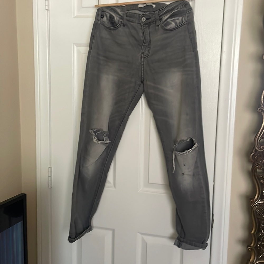 Skinny torn faded jeans.